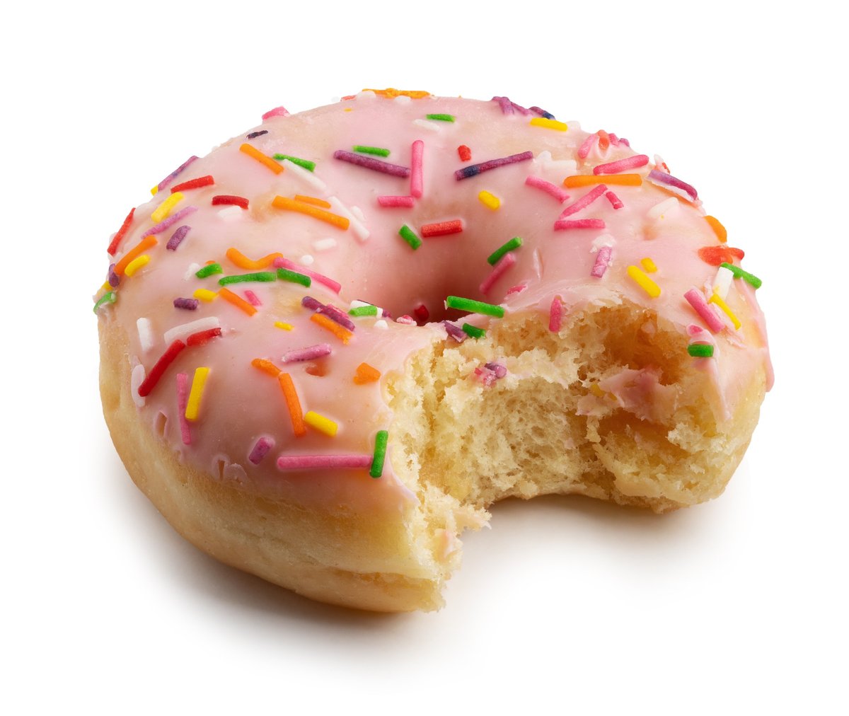 Closeup of a pink glazed donut with a bite taken out